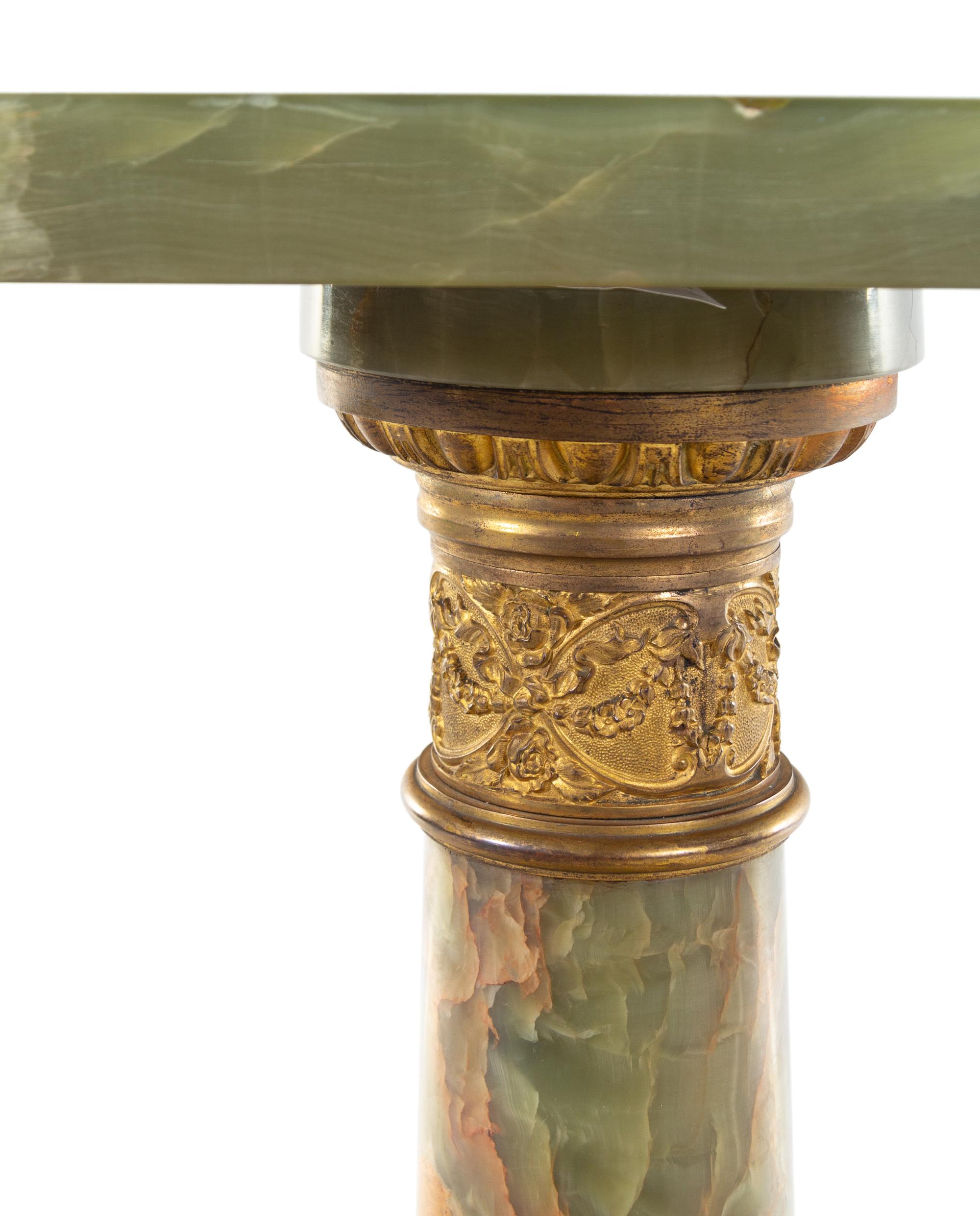 A Neoclassical Gilt Metal Mounted Onyx Pedestal