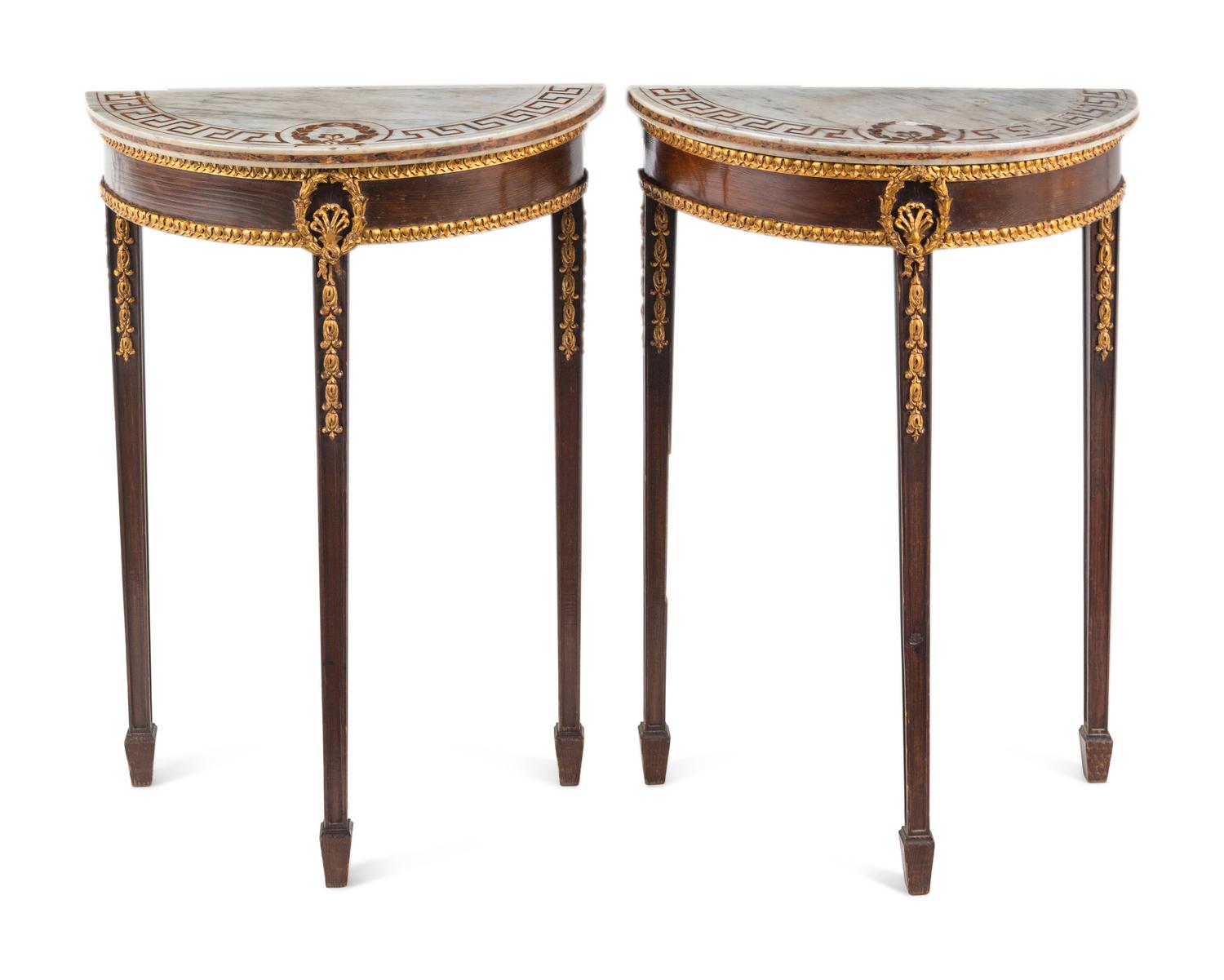 A Pair of Neoclassical Parcel-Gilt Mahogany Marble-Top Demilune Tables