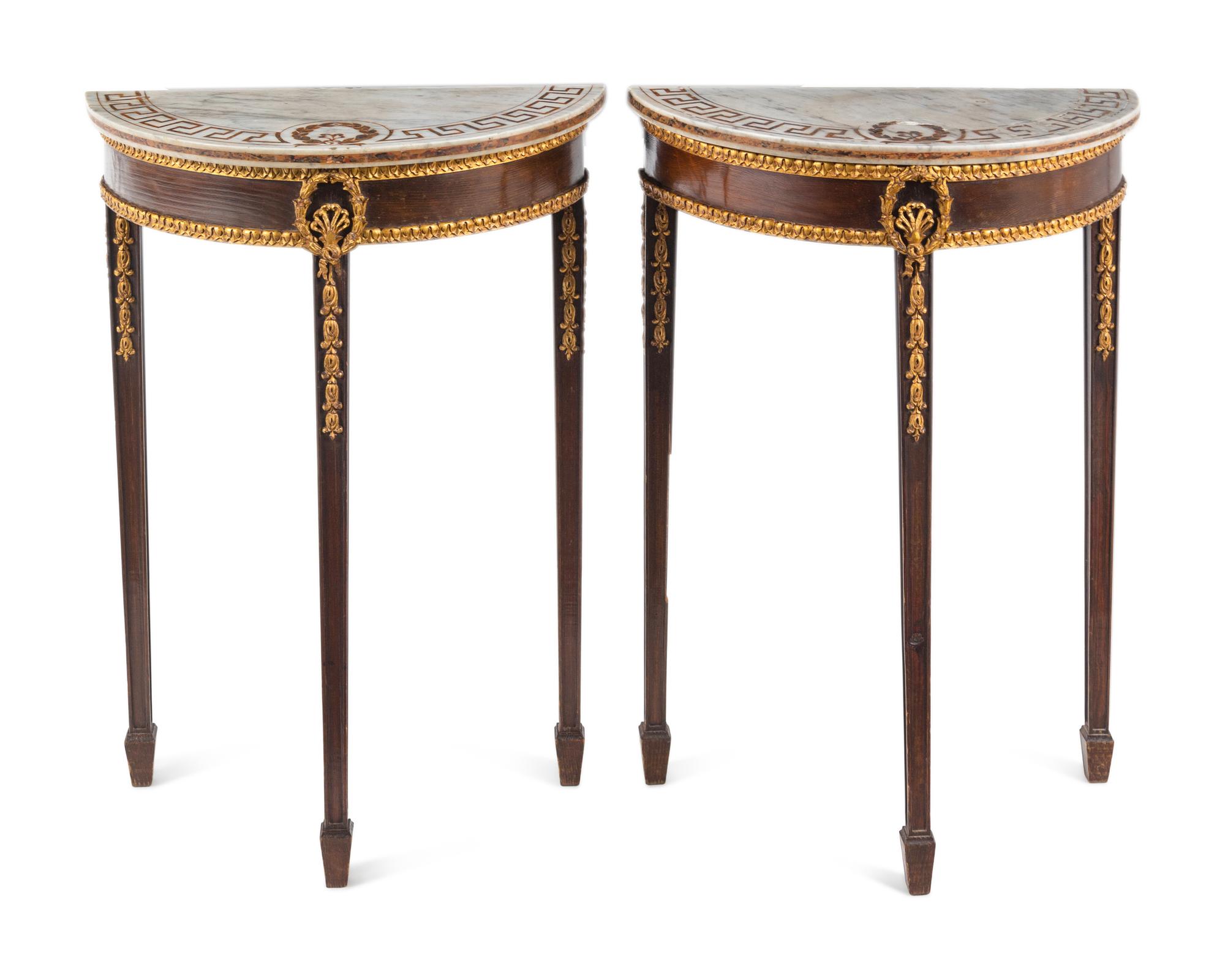 A Pair of Neoclassical Parcel-Gilt Mahogany Marble-Top Demilune Tables