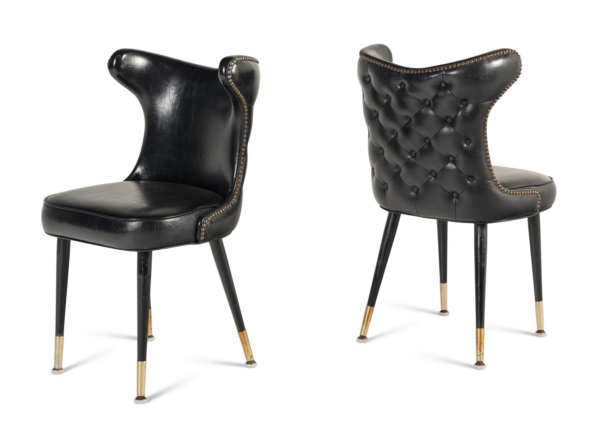 A Set of Six Leather-Upholstered Wingback Chairs