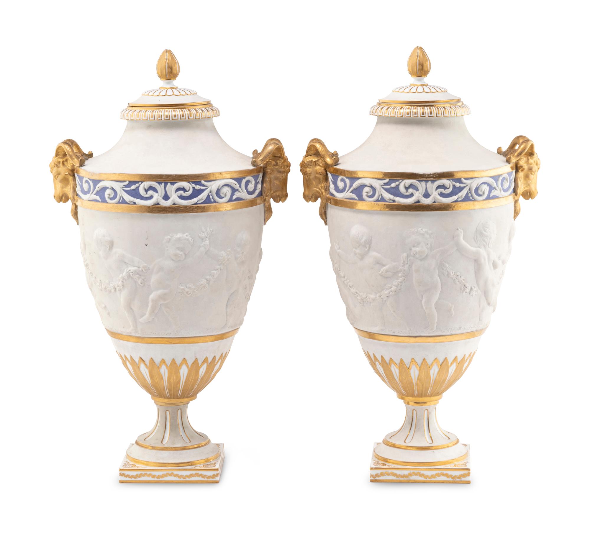 A Pair of Sèvres Style Biscuit Porcelain Vases and Covers