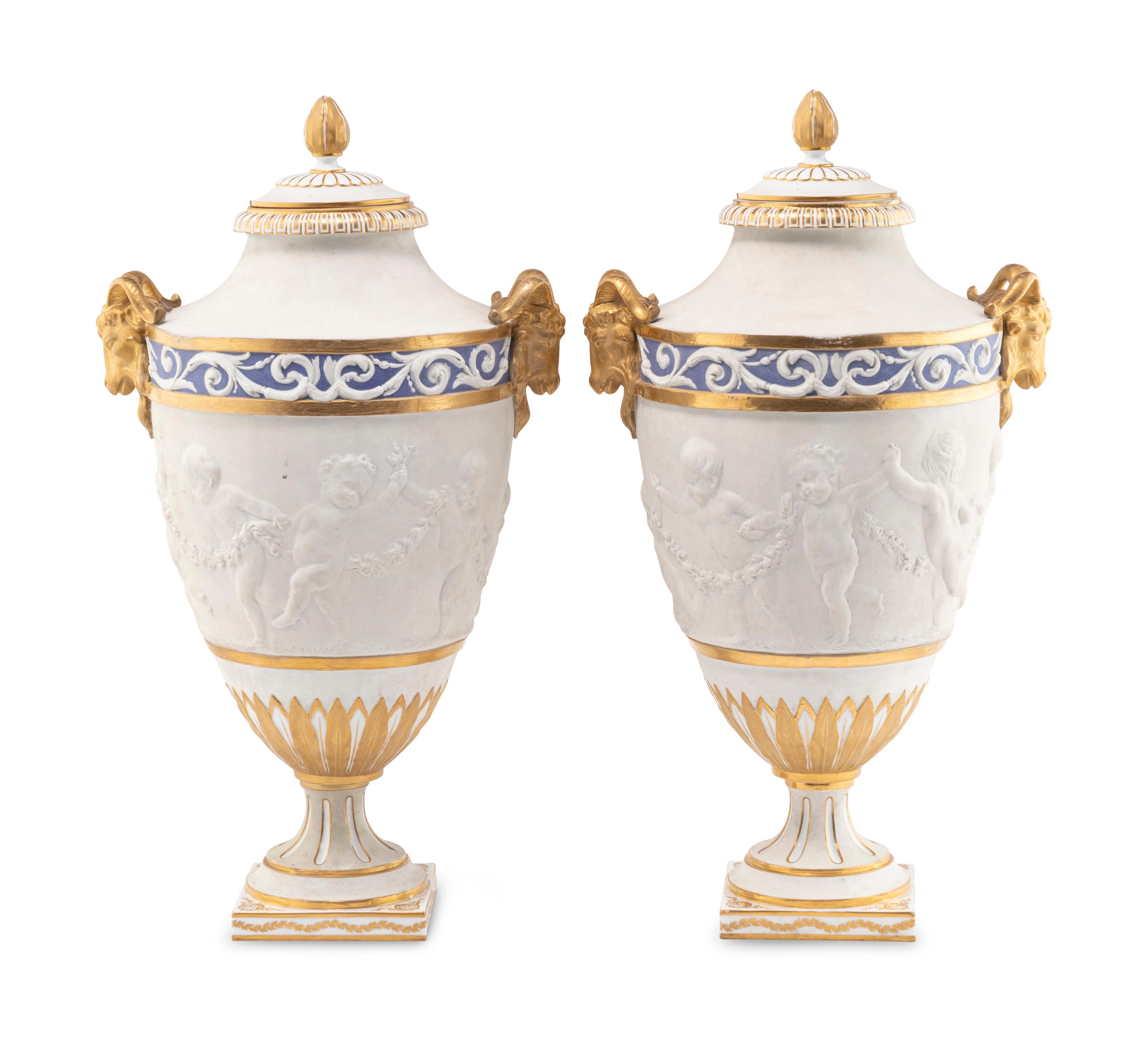 A Pair of Sèvres Style Biscuit Porcelain Vases and Covers