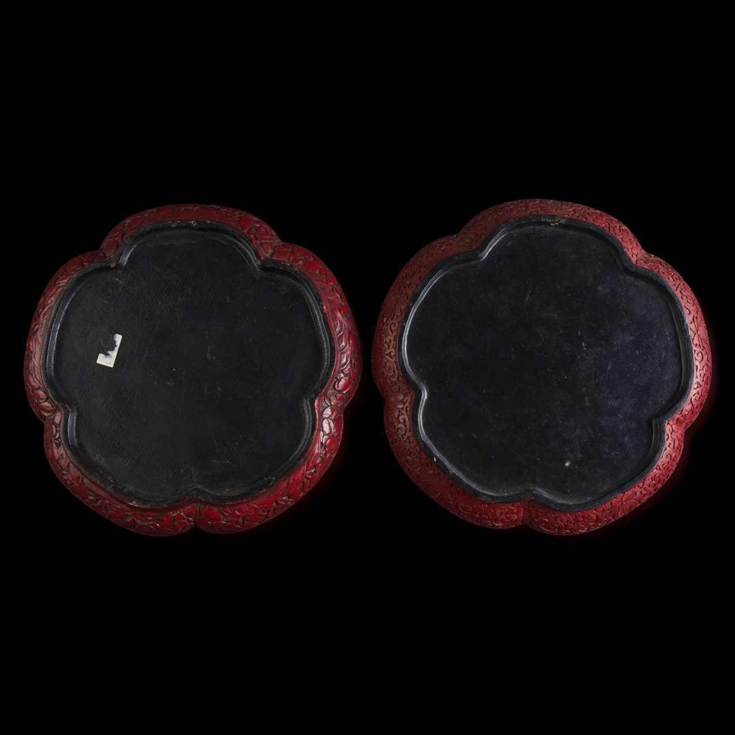 An associated pair of Chinese carved cinnabar lacquer dishes, and a small circular box 大漆 盘子或一对及一小盖盒