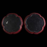 An associated pair of Chinese carved cinnabar lacquer dishes, and a small circular box 大漆 盘子或一对及一小盖盒