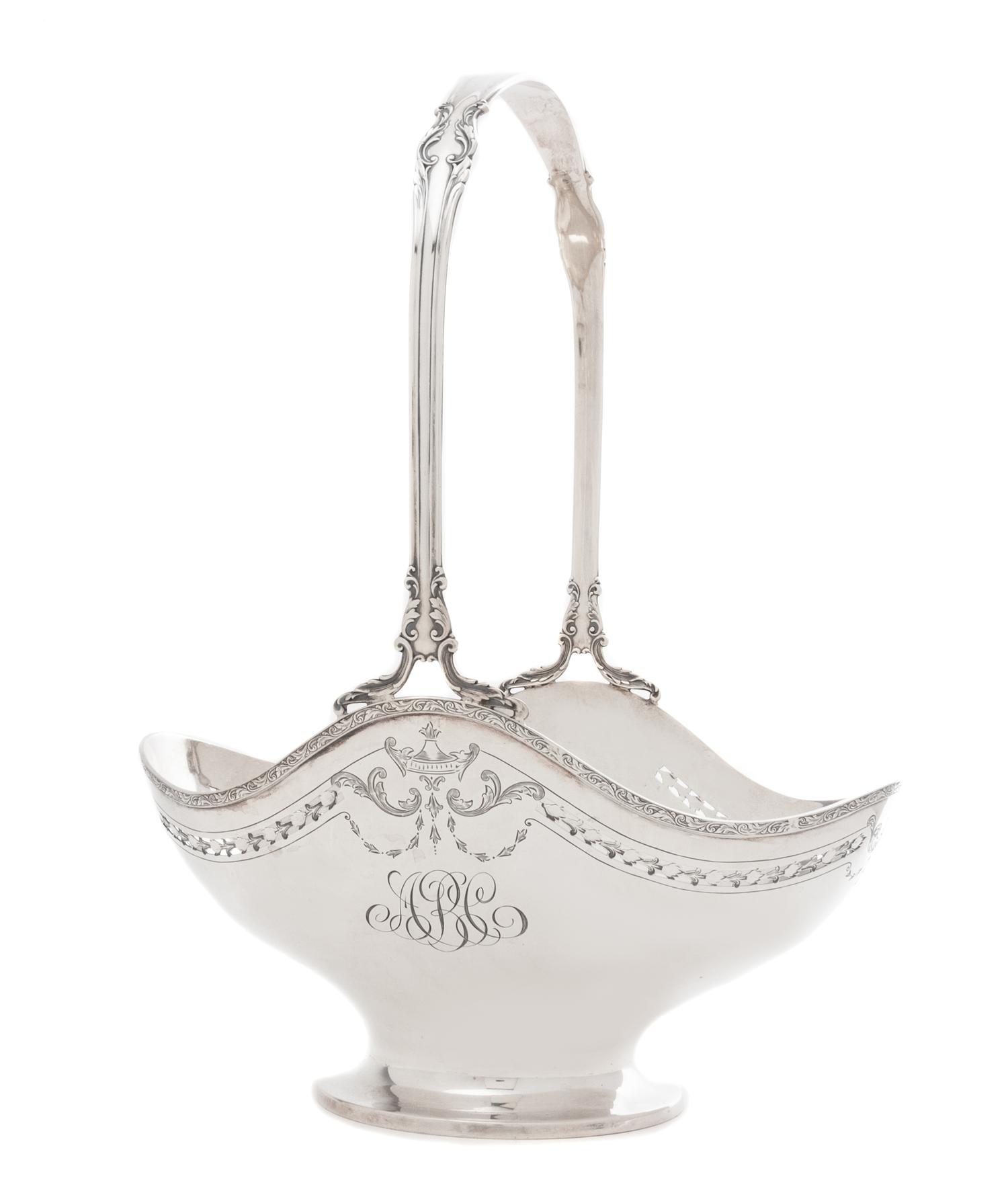An American Silver Flower Basket, International Silver Co., Meriden, CT, First Half 20th Century, the foliate scroll handle above the o