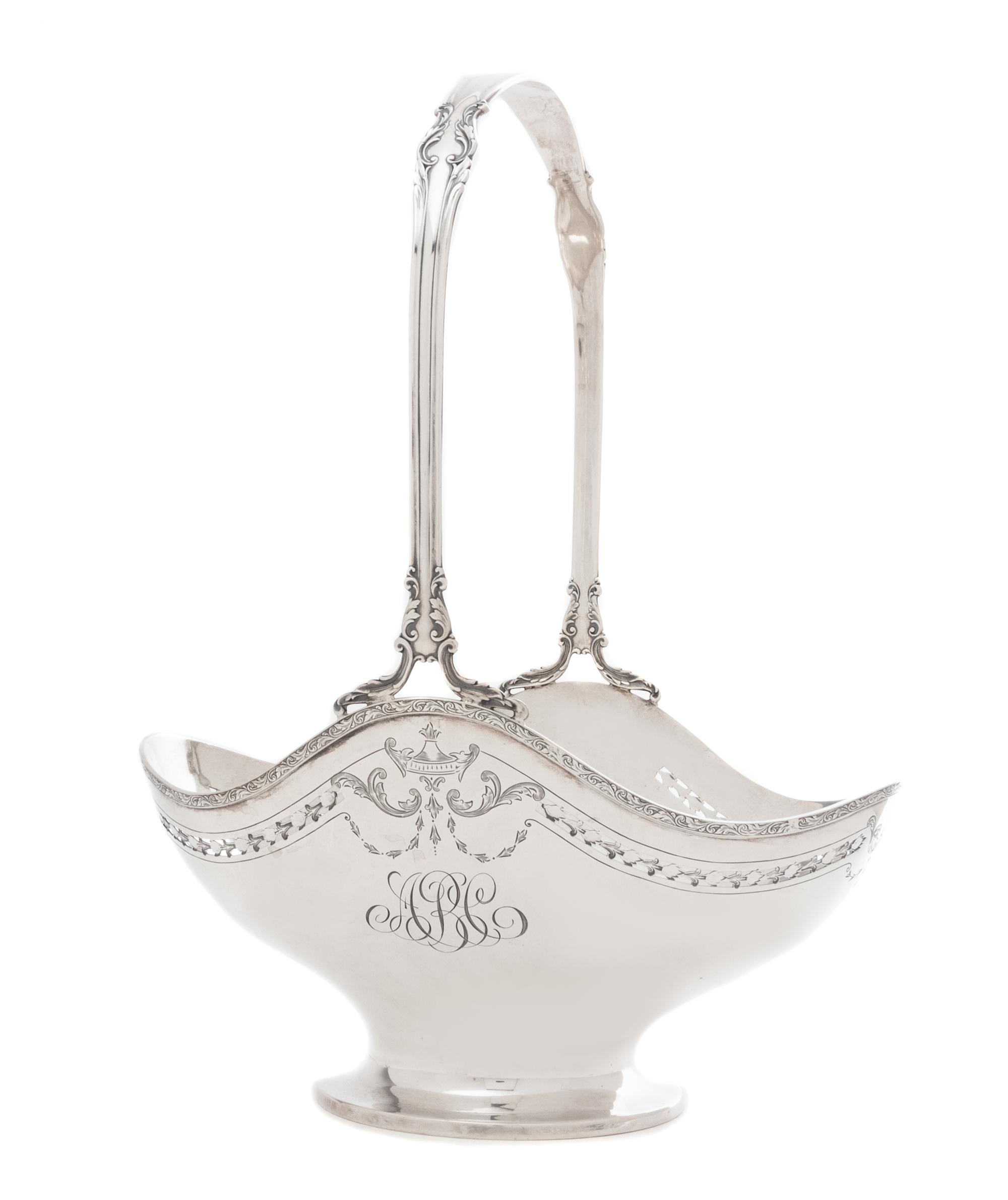An American Silver Flower Basket, International Silver Co., Meriden, CT, First Half 20th Century, the foliate scroll handle above the o