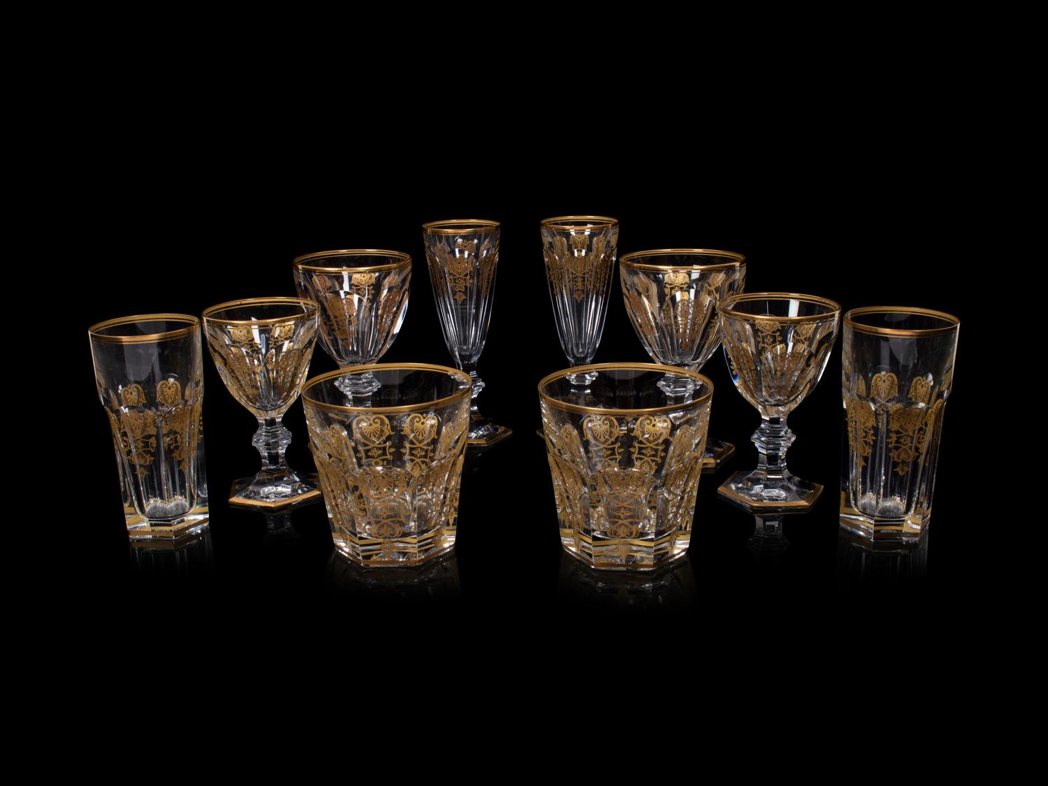 A Baccarat Empire Gilt Decorated Stemware Service