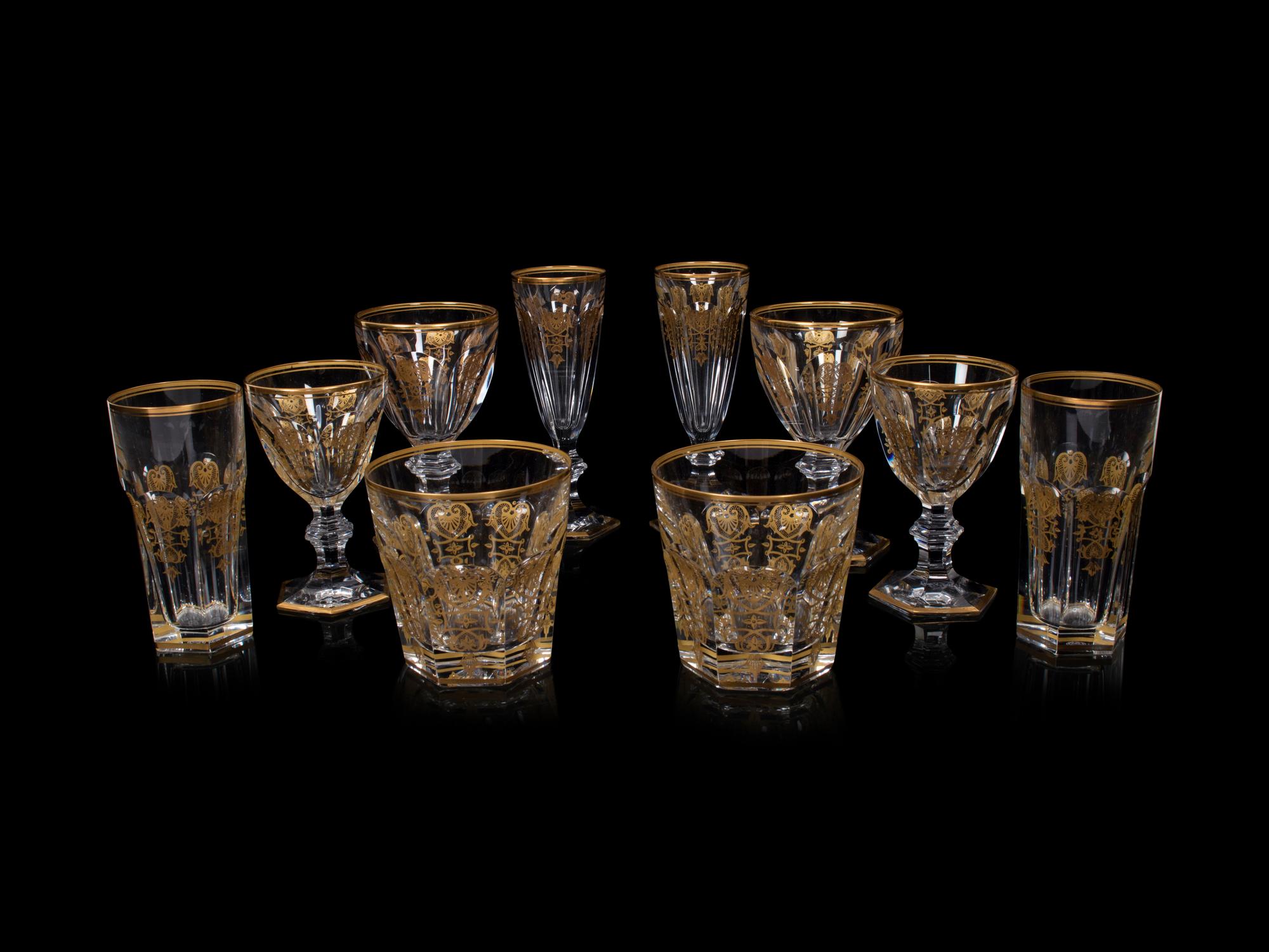 A Baccarat Empire Gilt Decorated Stemware Service