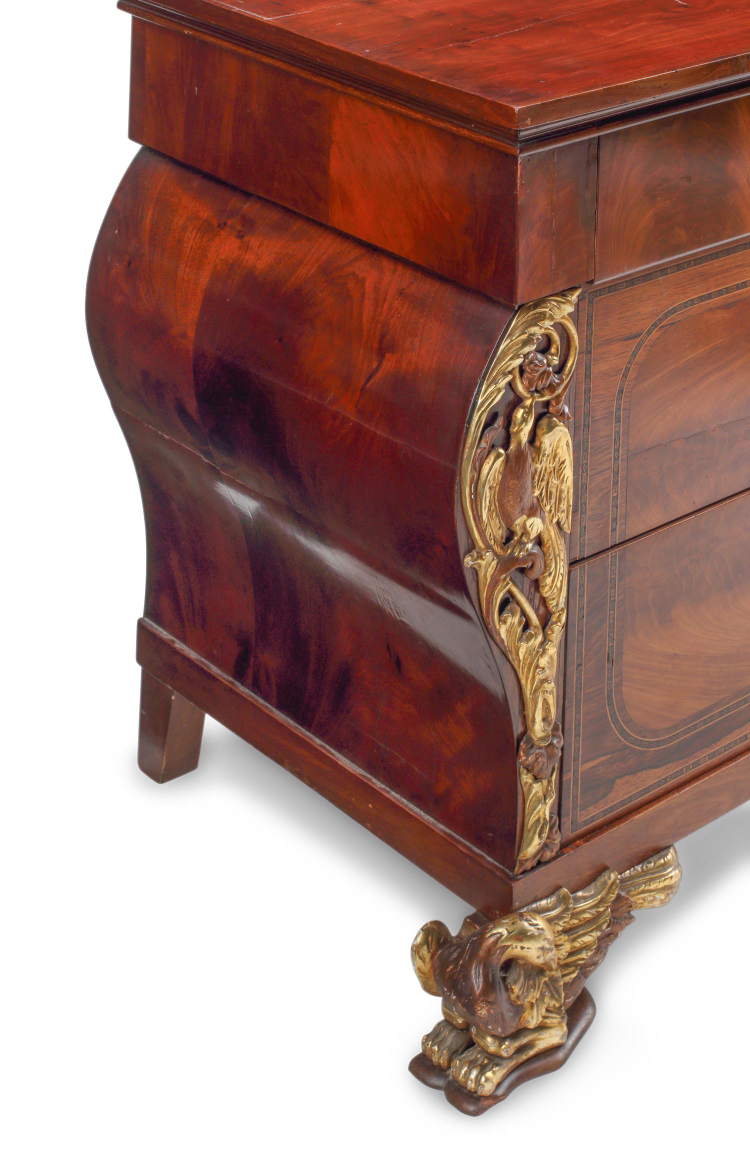 An Italian Parcel-Gilt Mahogany Chest of Drawers