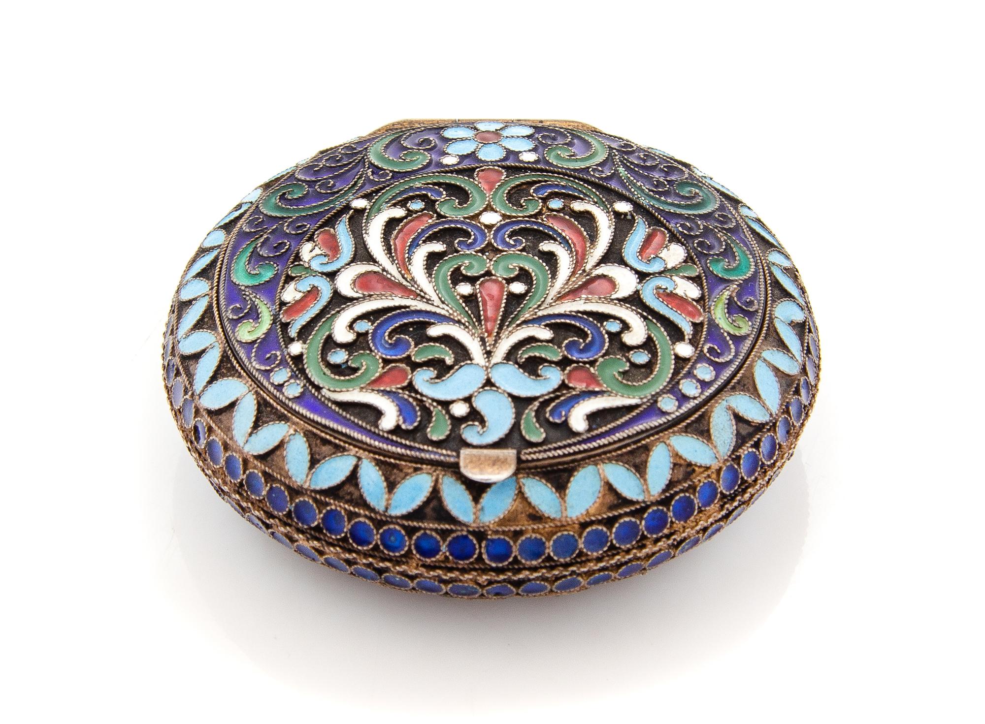 A Russian Enameled Silver Snuff Box, Maker's Mark Cyrillic IZO, Moscow, Mid-20th Century, the circular case with polychrome enameled fl