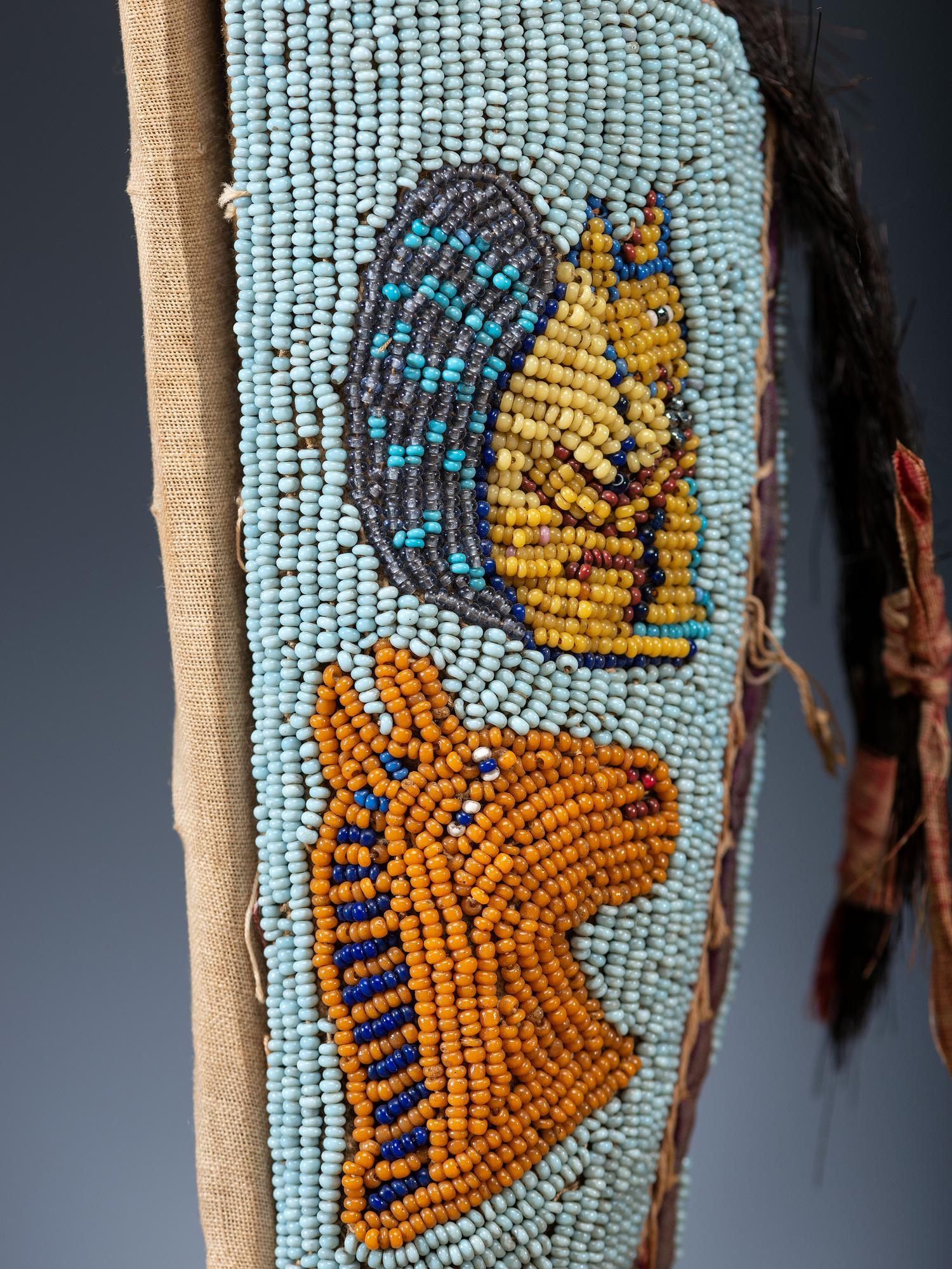 Nez Perce Beaded Pictorial Toy Cradle, with Doll