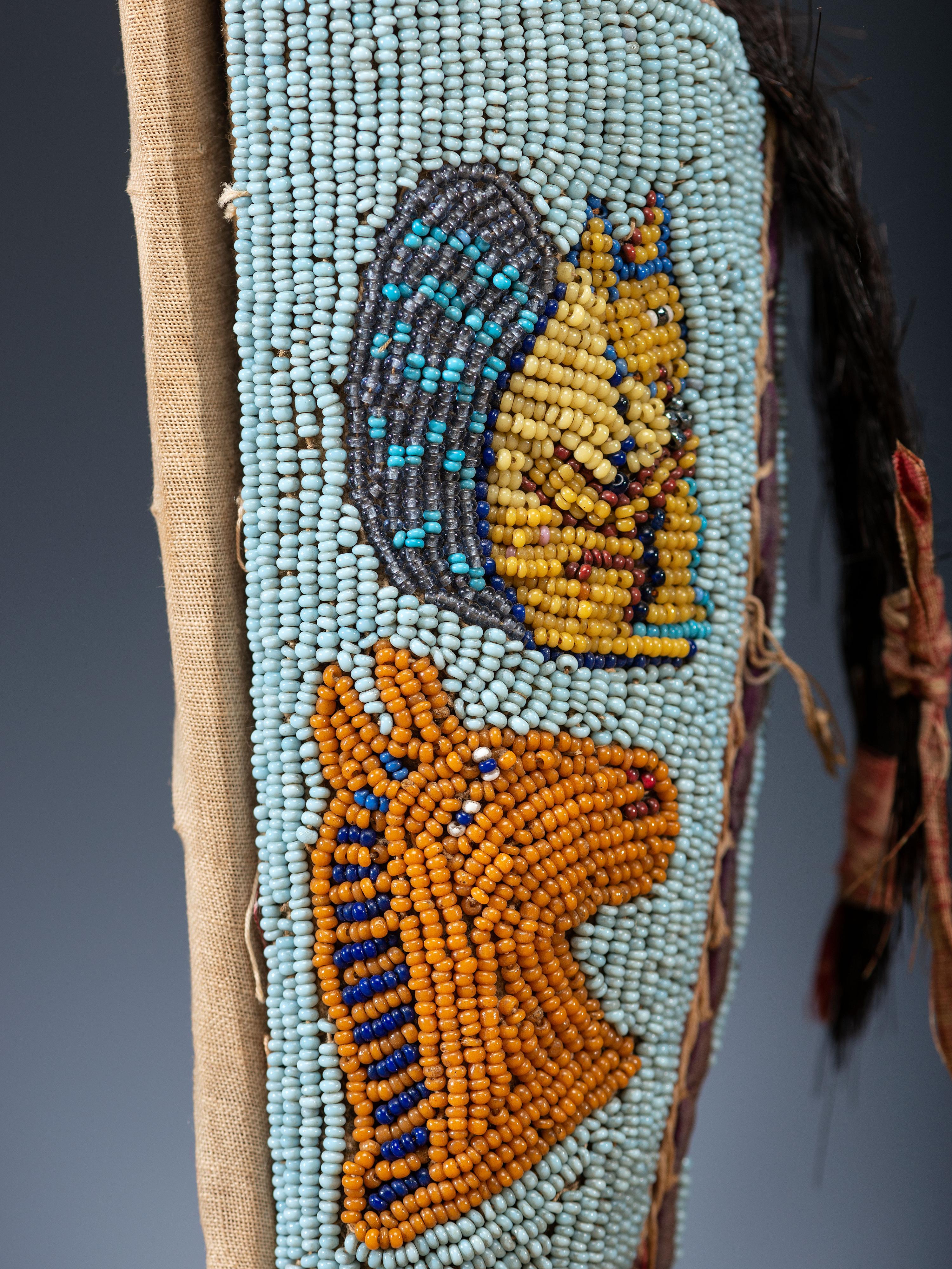 Nez Perce Beaded Pictorial Toy Cradle, with Doll