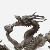 A Japanese patinated bronze dragon and rock crystal sphere Meiji period