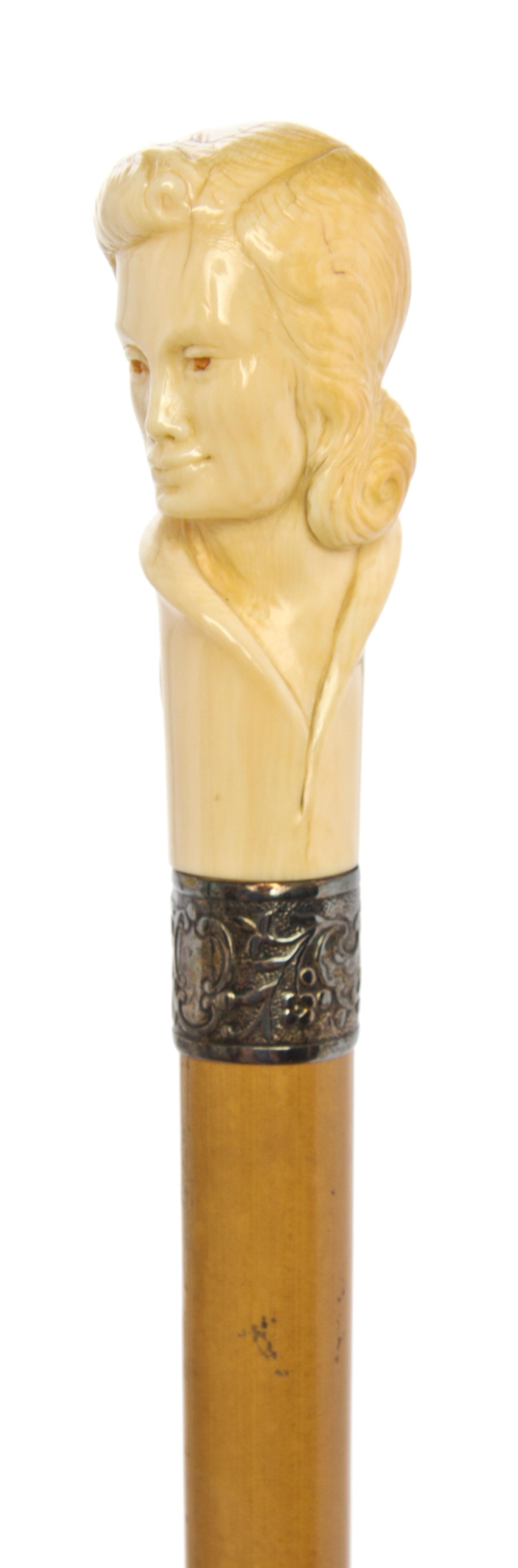 A Continental Ivory Handled Cane, Length of handle 3 3/4 x length overall 37 1/4 inches.