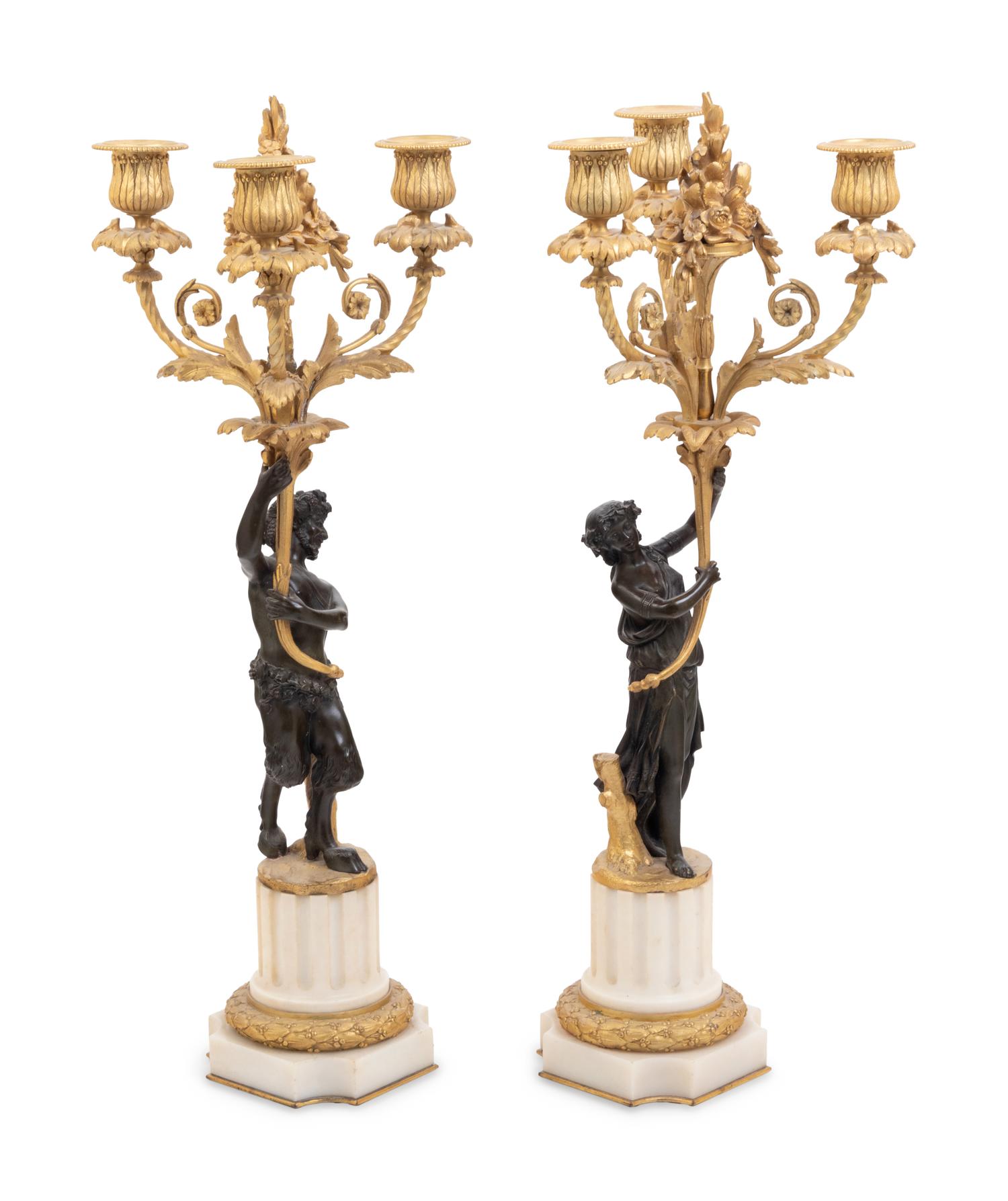 A Pair of Louis XVI Style Parcel Gilt and Bronze Three-Light Figural Candelabra