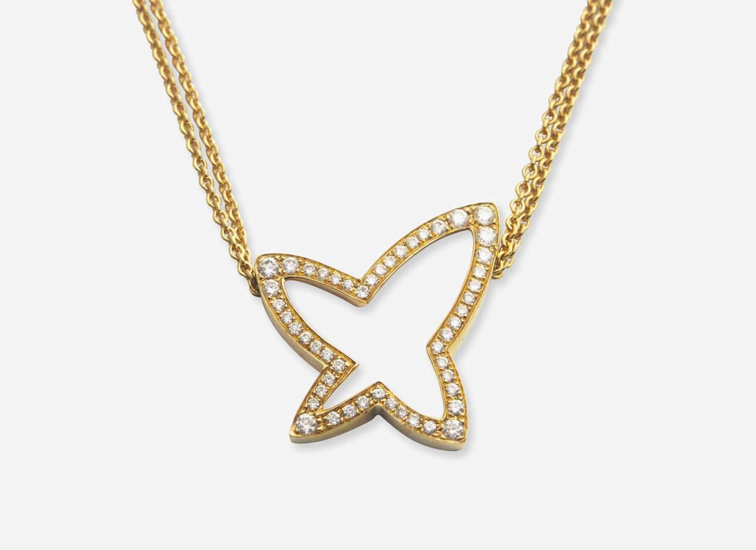 An 18K Yellow Gold Earrings and Necklace Set by Movado