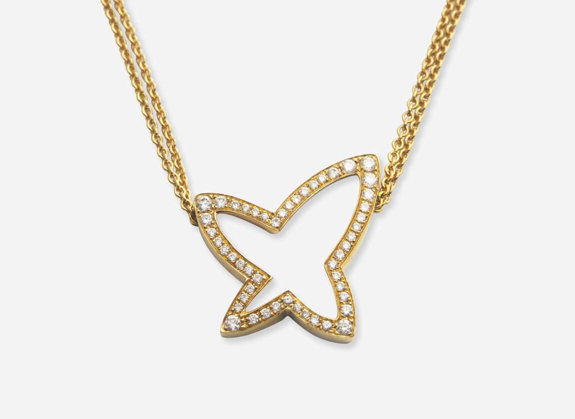 An 18K Yellow Gold Earrings and Necklace Set by Movado