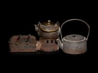 Seven Japanese Cast Iron Teapots, Tetsubin, and Burner