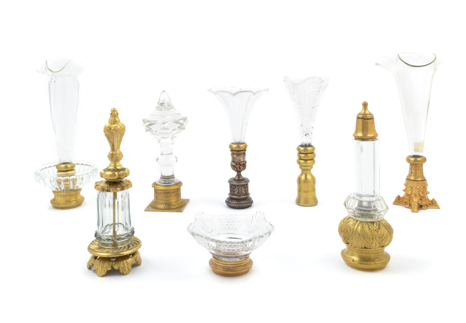 Eight Gilt Bronze and Glass Table Articles
