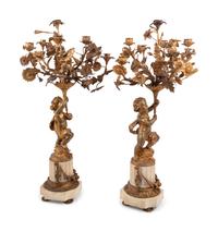 A Pair of French Gilt Bronze and Marble Figural Eight-Light Candelabra