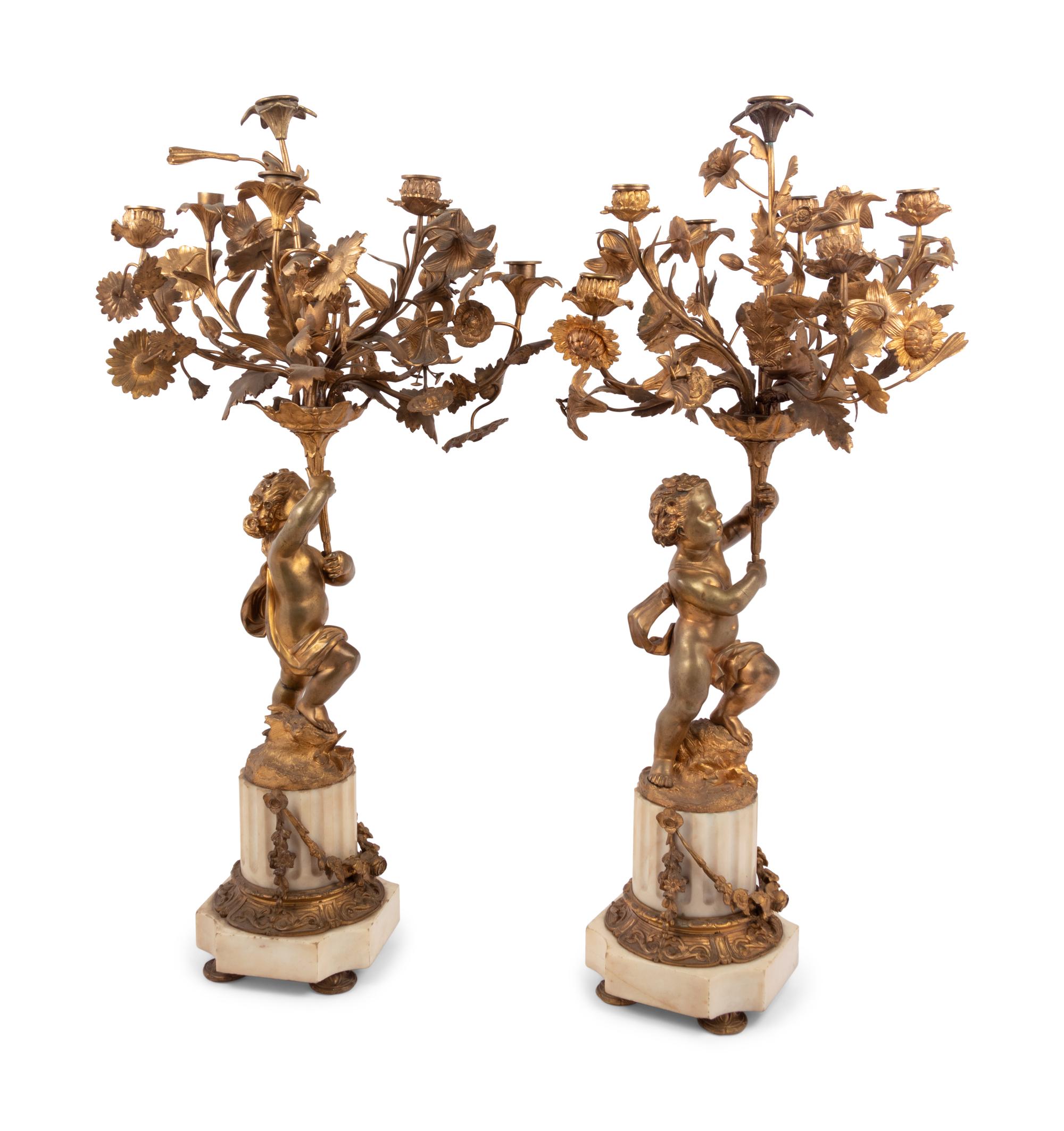 A Pair of French Gilt Bronze and Marble Figural Eight-Light Candelabra