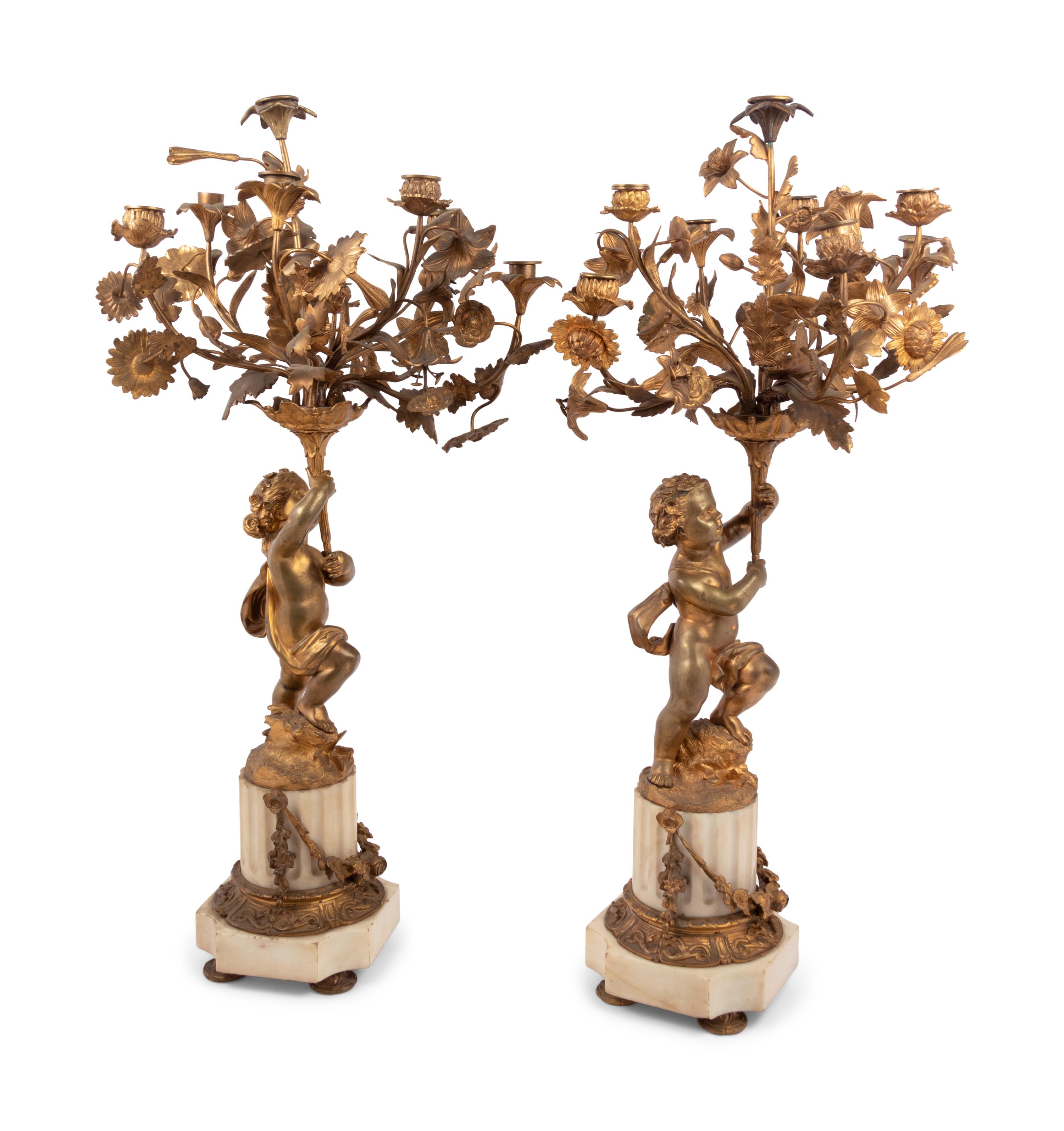 A Pair of French Gilt Bronze and Marble Figural Eight-Light Candelabra