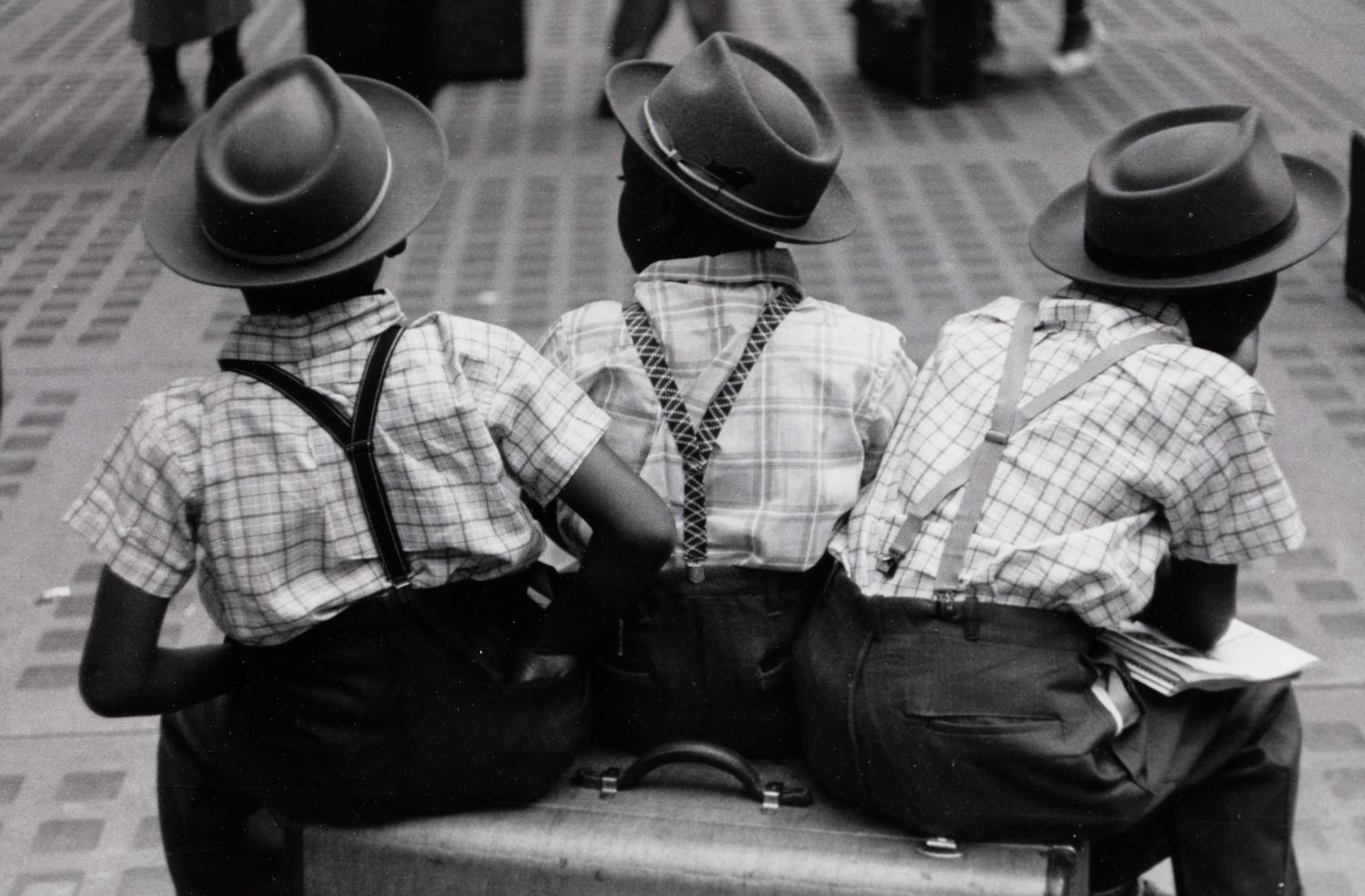 Ruth Orkin (1921-1985) Three Boys on a Suitcase, Penn Station, 1947