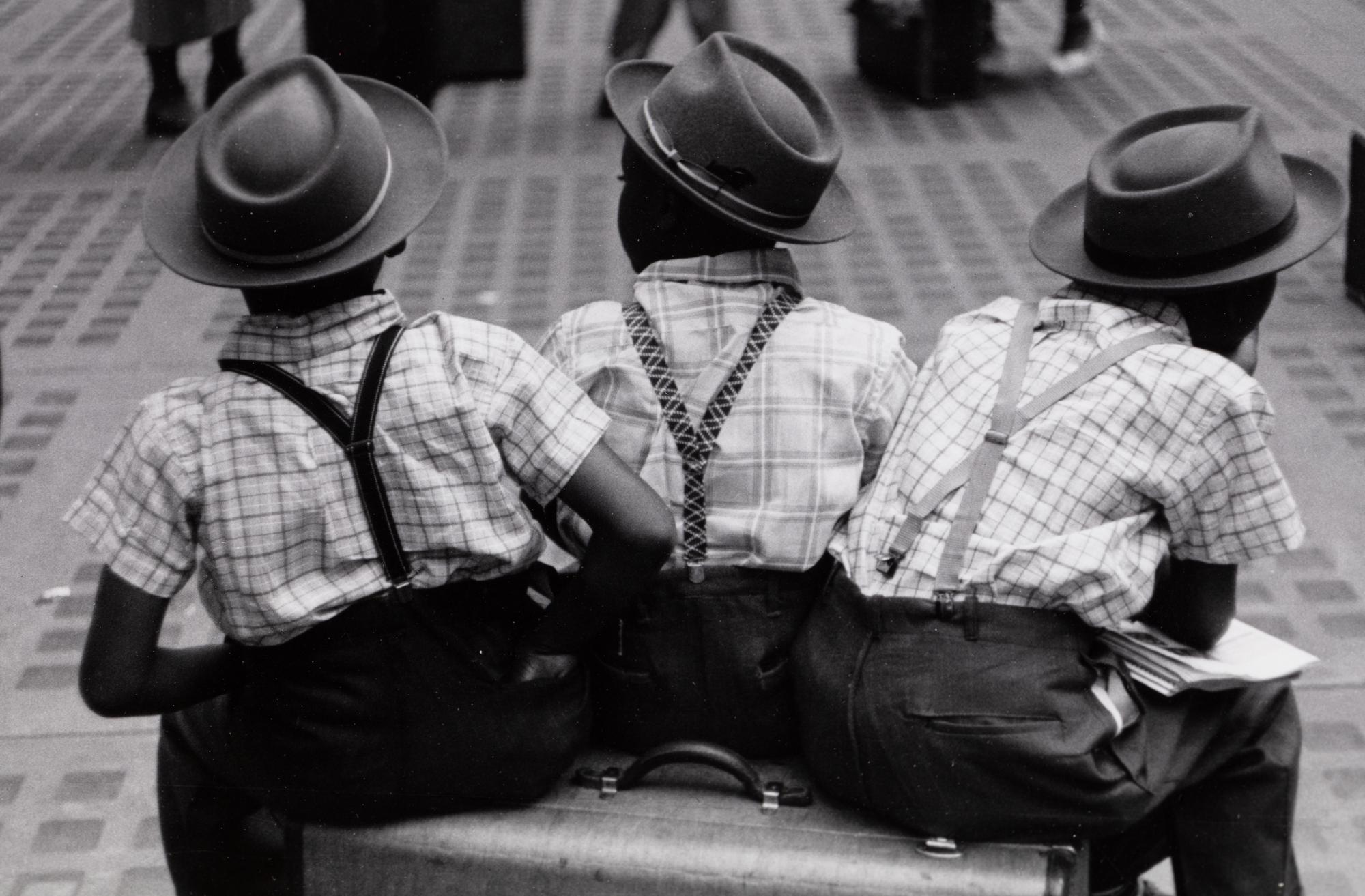 Ruth Orkin (1921-1985) Three Boys on a Suitcase, Penn Station, 1947