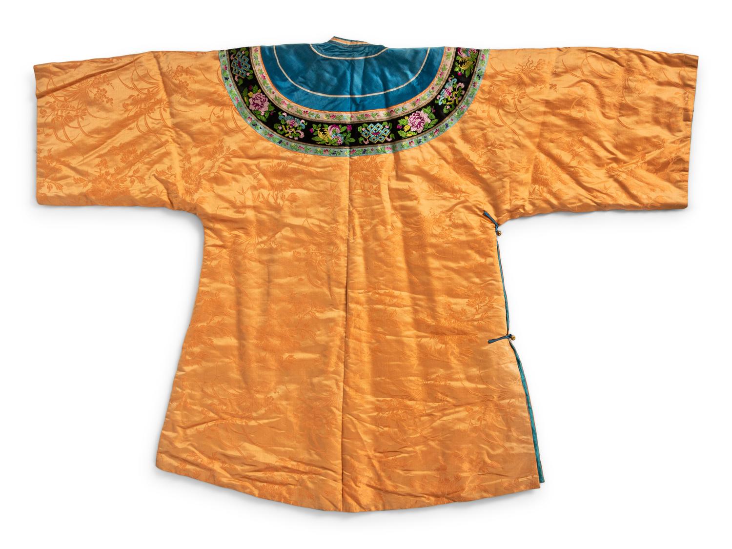 A Chinese Lady's Embroidered Silk Jacket and A Yellow Ground Silk Apron Skirt