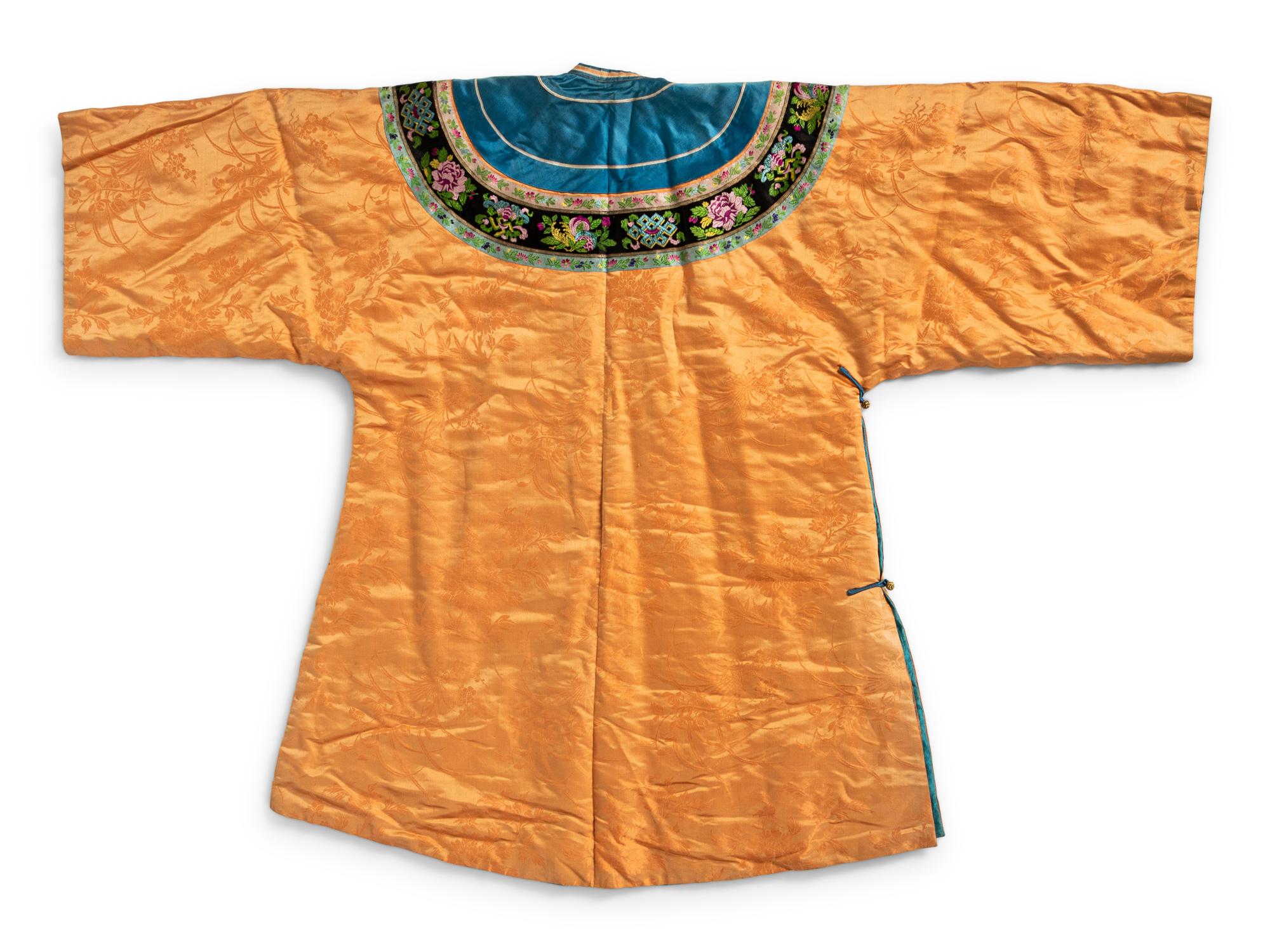 A Chinese Lady's Embroidered Silk Jacket and A Yellow Ground Silk Apron Skirt
