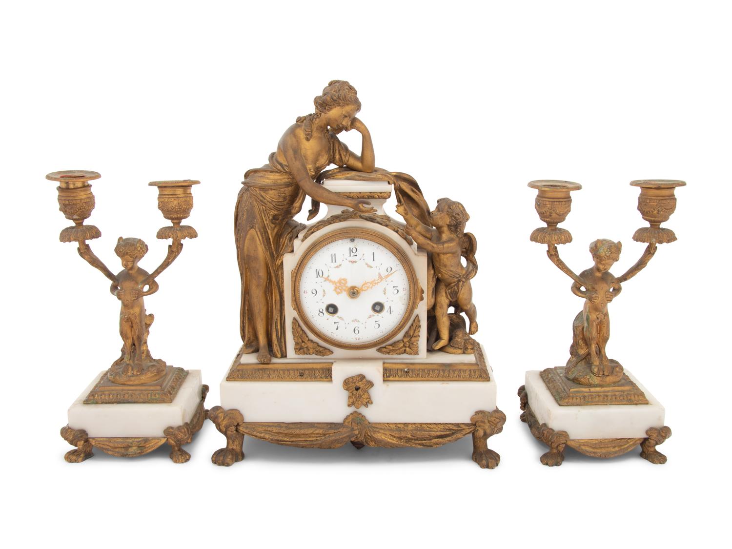 A French Gilt Bronze and Marble Clock Garniture