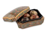 A Kashmiri Lacquer Box and Seven Lacquer Eggs