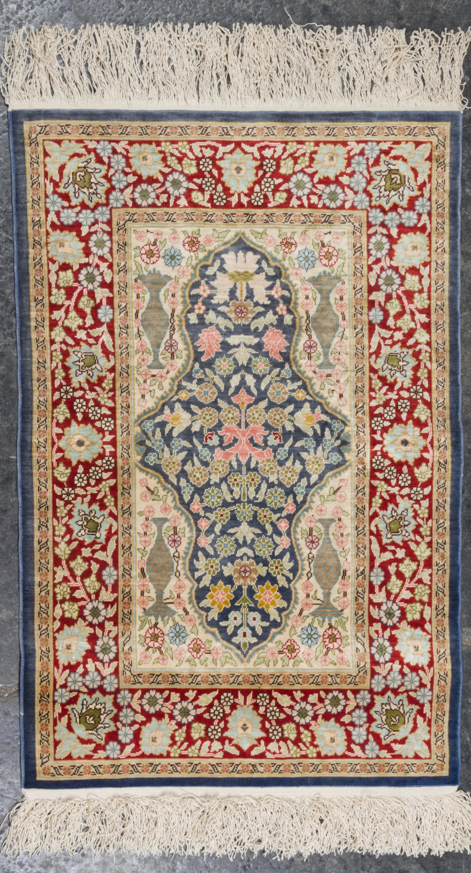 A Persian Silk and Wool Mat 2 feet 6 inches x 1 foot 7 inches. — SECOND HALF 20TH CENTURY
