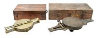 A Group of Two Brass Surveor's Compasses Width of larger example 16 inches.