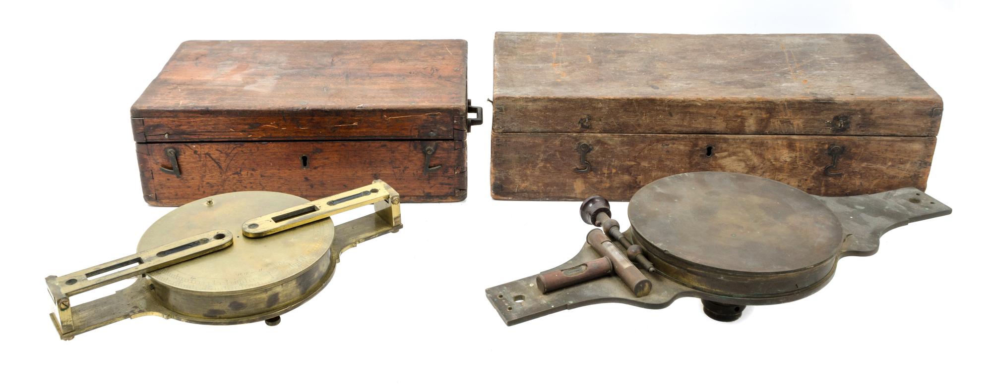 A Group of Two Brass Surveor's Compasses Width of larger example 16 inches.