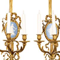 A Set of Four Gilt Bronze and Jasperware Mounted Three-Light Sconces