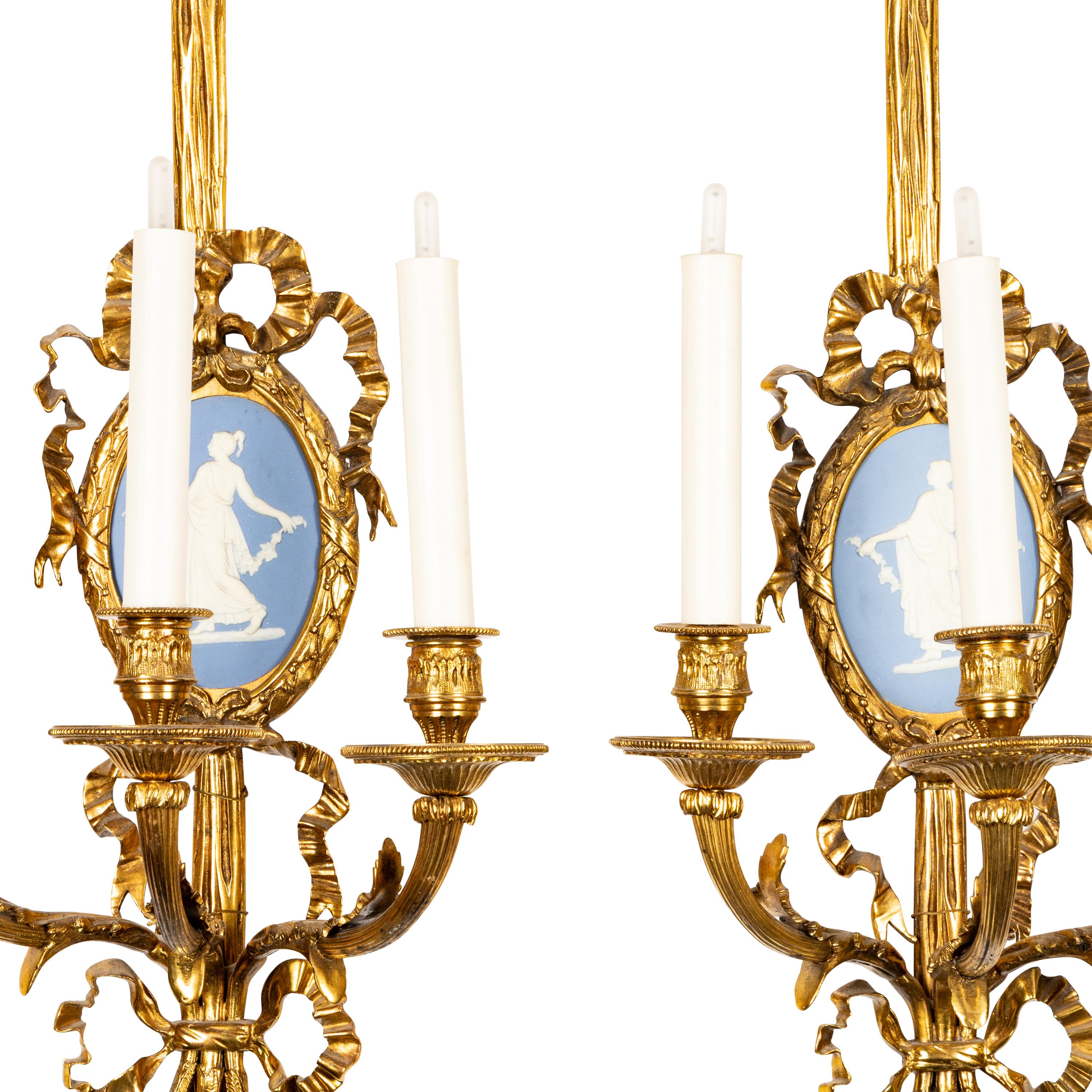 A Set of Four Gilt Bronze and Jasperware Mounted Three-Light Sconces