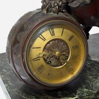 A Japanesque patinated bronze and verde marble mantel clock J.E. Caldwell & Co., Philadelphia, PA, late 19th / early 20th century