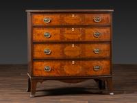 A Federal Inlaid and Figured Mahogany Bow-Front Chest of Drawers