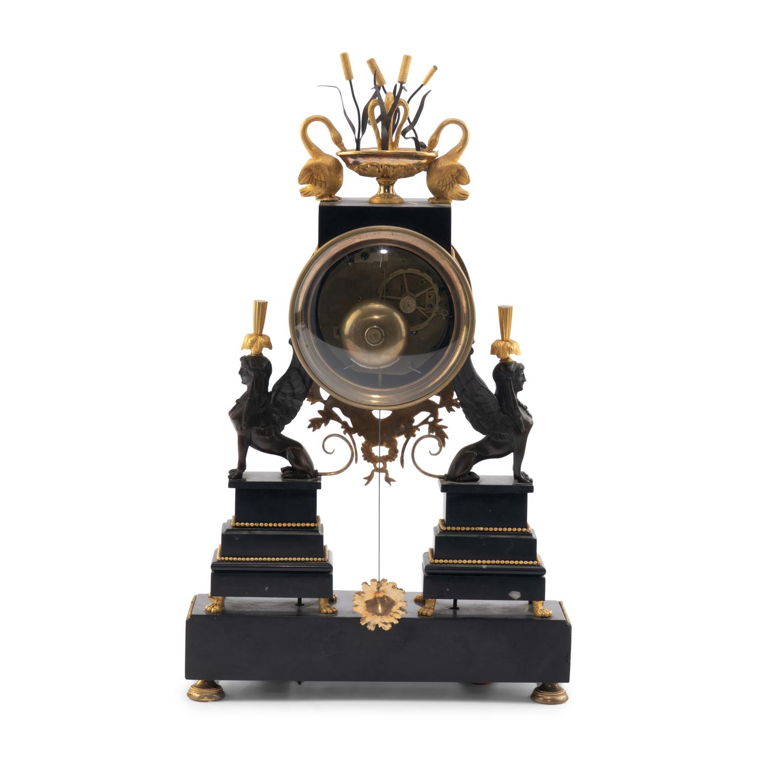 An Empire Ormolu, Black Granite and Patinated Bronze Mantel Clock