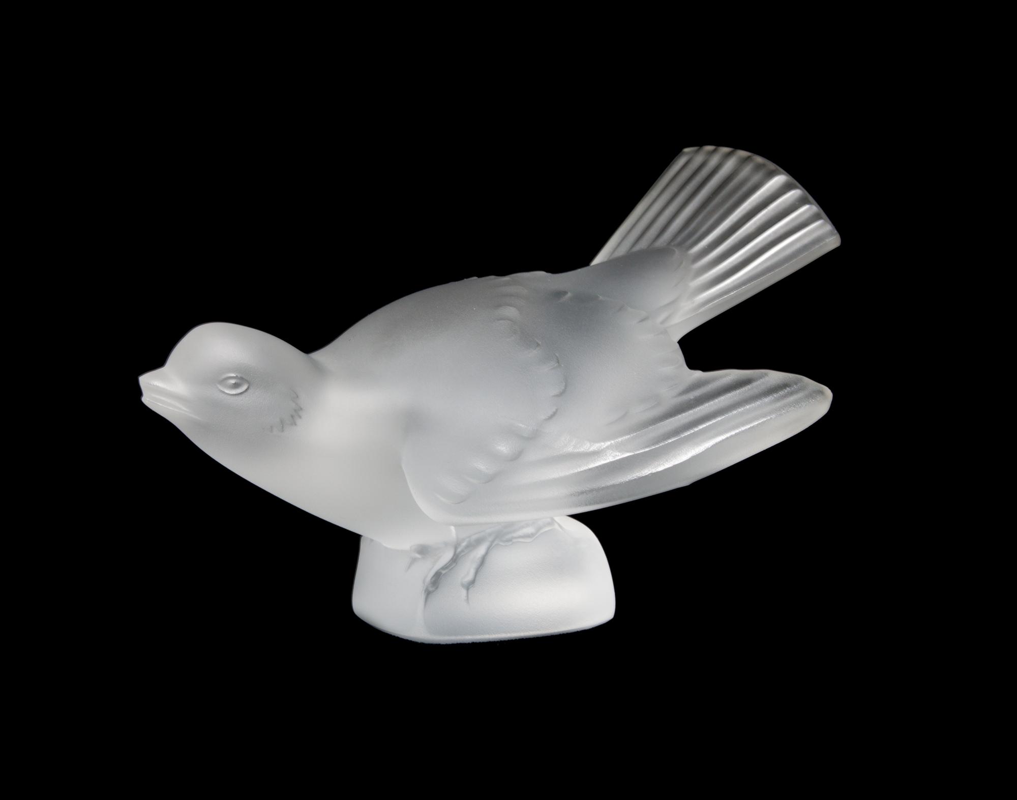 A Lalique Molded and Frosted Glass Figure Height 3 1/4 x width 5 inches.