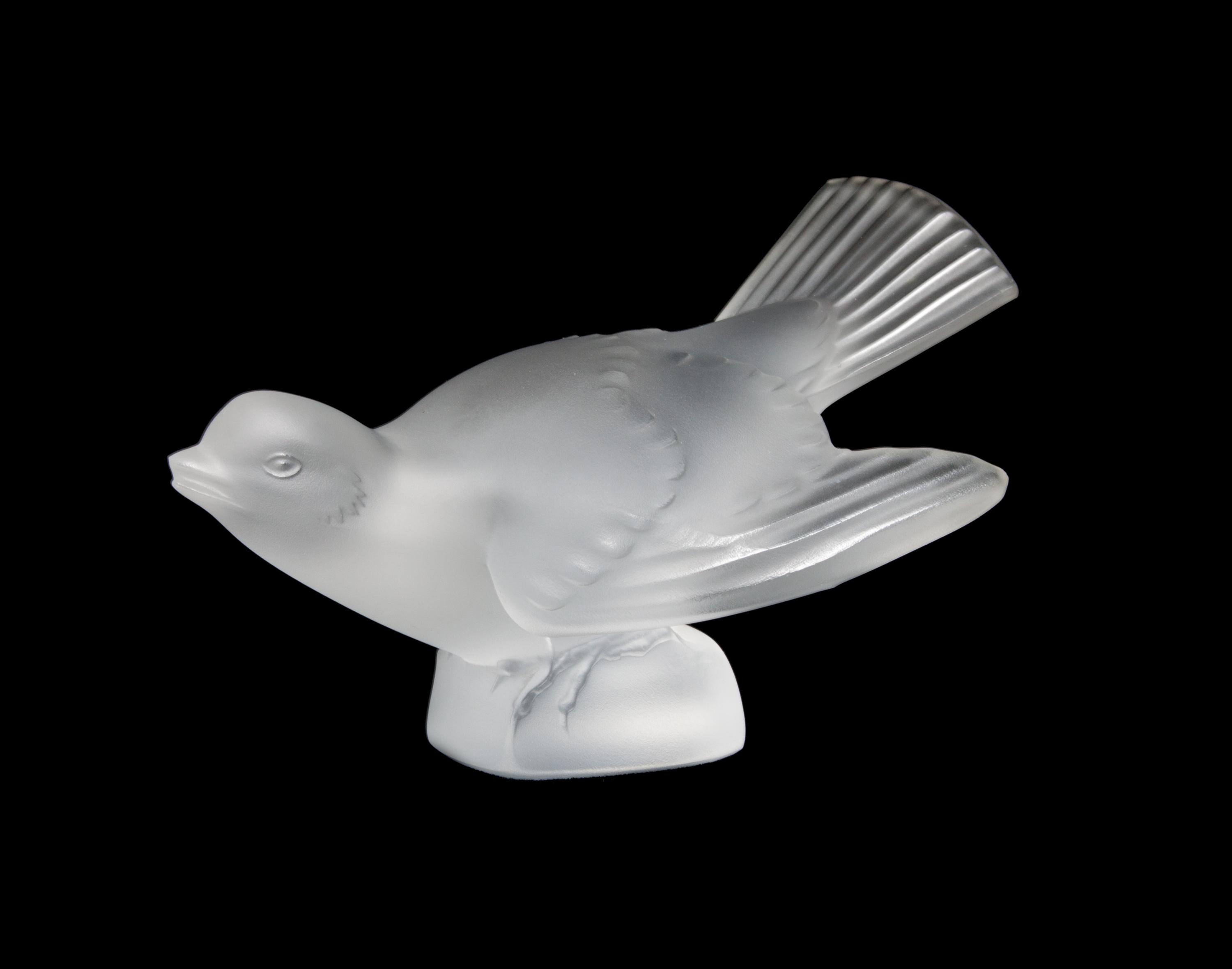 A Lalique Molded and Frosted Glass Figure Height 3 1/4 x width 5 inches.