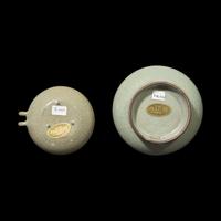 A Chinese Longquan Guan Type Celadon Vase and a Bird Feeder 龍泉青釉穿帶瓶及鳥食罐