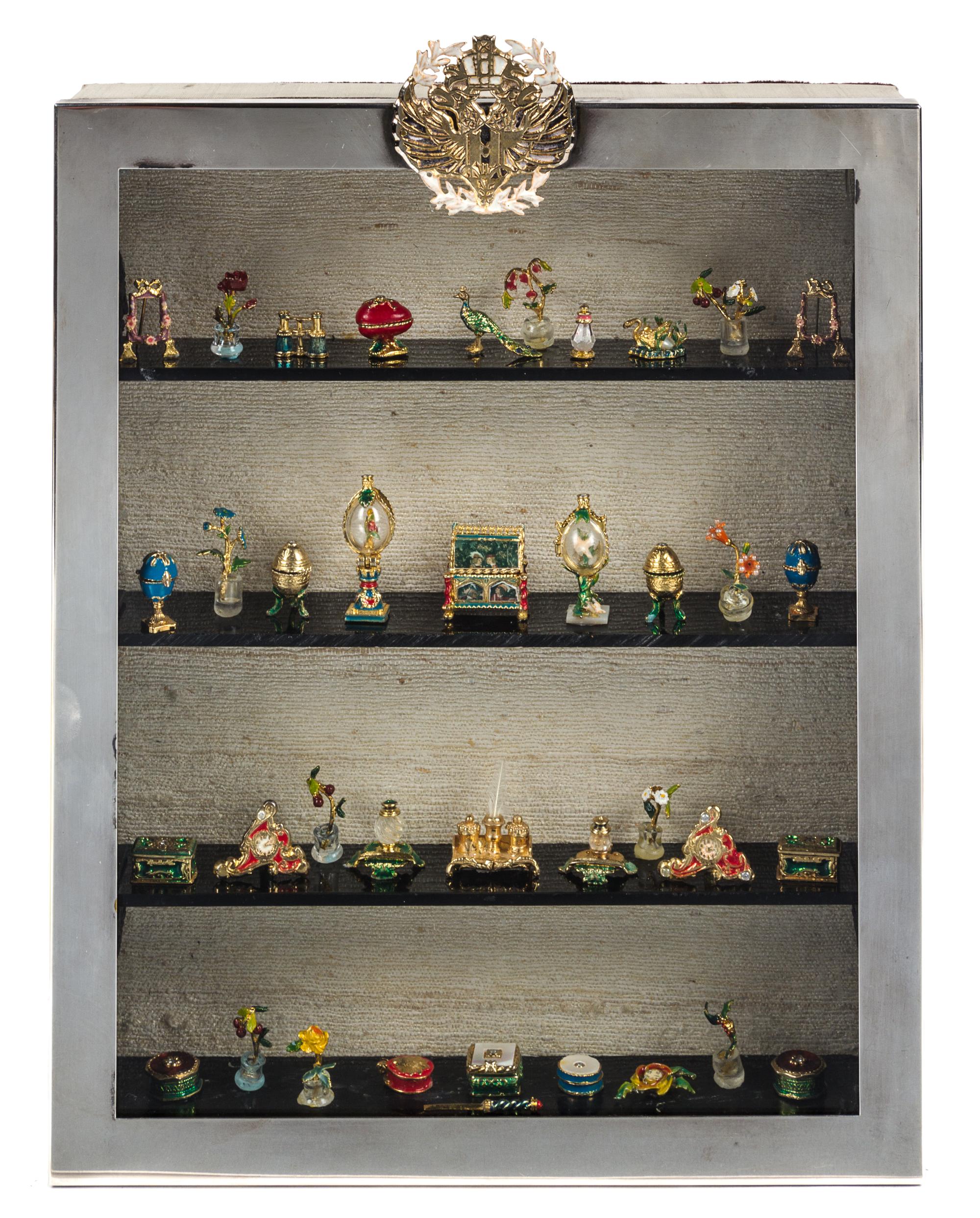 A Collection of Gilt Bronze and Enameled "Faberge" Series Table Articles Height of silver-plate case 10 3/4 inches. — Eugene Kupjack