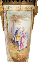 A Pair of Gilt Bronze Mounted Sèvres Style Porcelain Urns