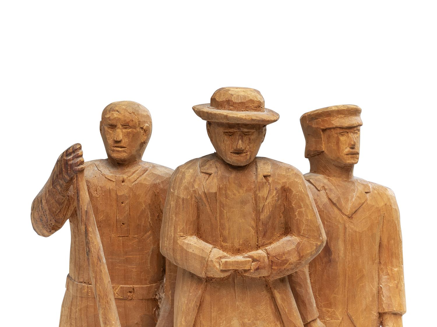 A Folk Art Carved Pine Group of Lumberjacks
