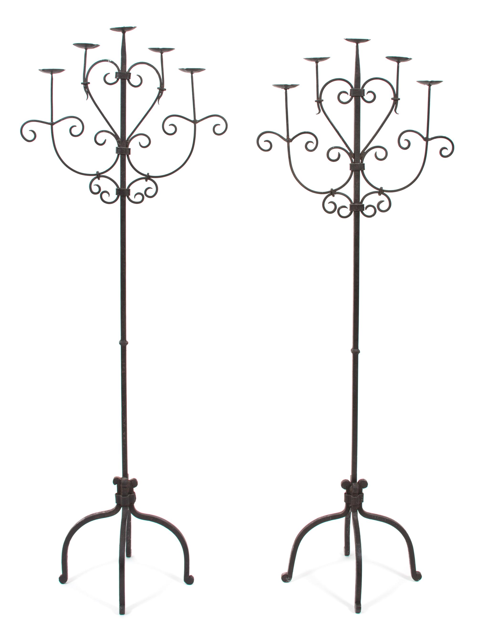 A Pair of Wrought Iron Five-Light Torcheres Height 63 1/2 inches. — 20TH CENTURY