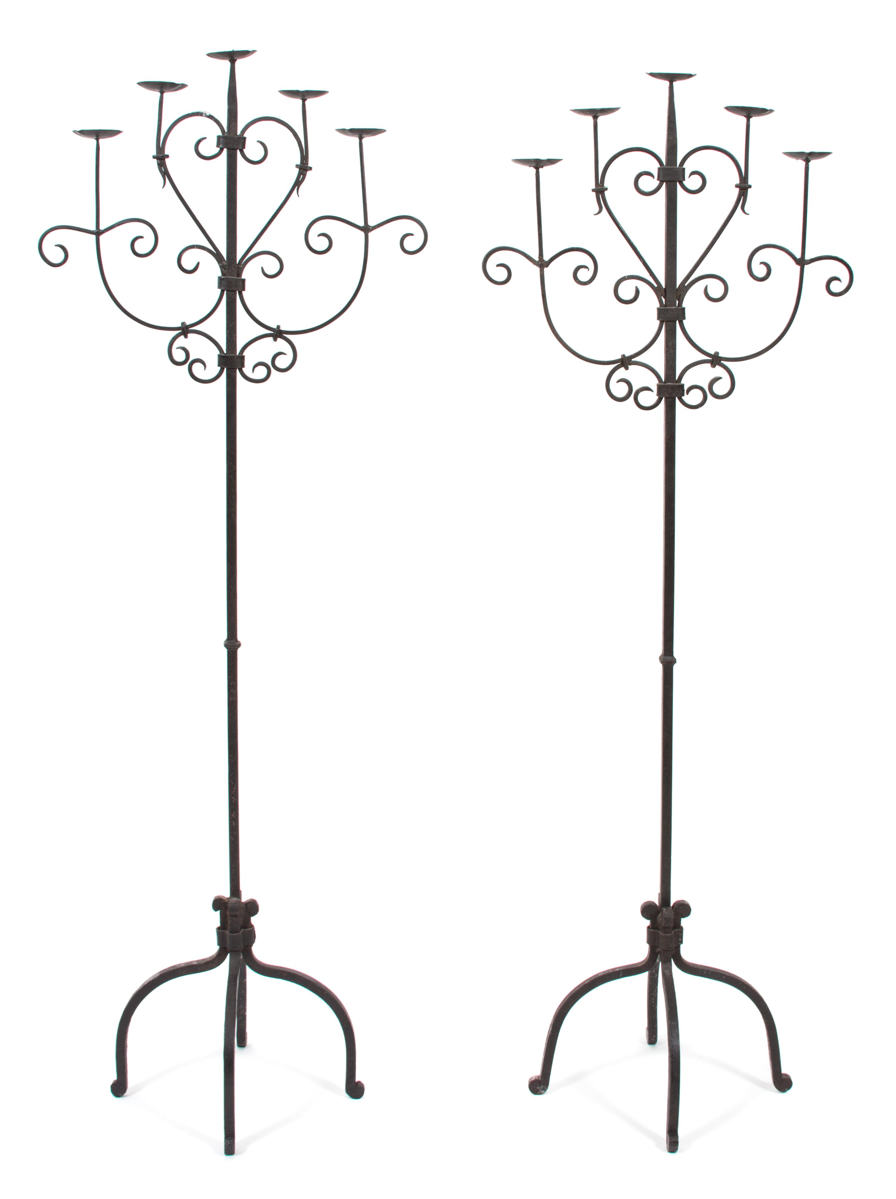 A Pair of Wrought Iron Five-Light Torcheres Height 63 1/2 inches. — 20TH CENTURY