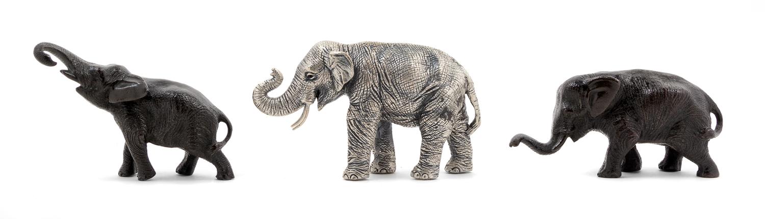 A Group of Three Metal Figures of Elephants