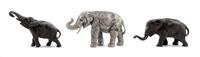 A Group of Three Metal Figures of Elephants